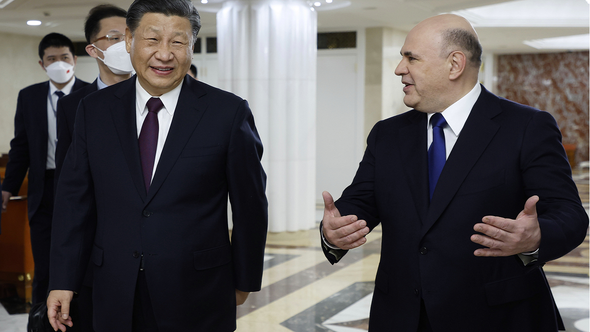 China's Xi Jinping speaks with Russian prime minister
