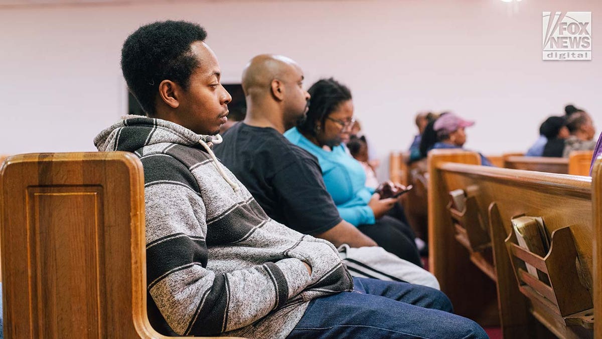Friends, family, and church members mourn the loss of Zindell Brown at a church in Scranton, South Carolina.