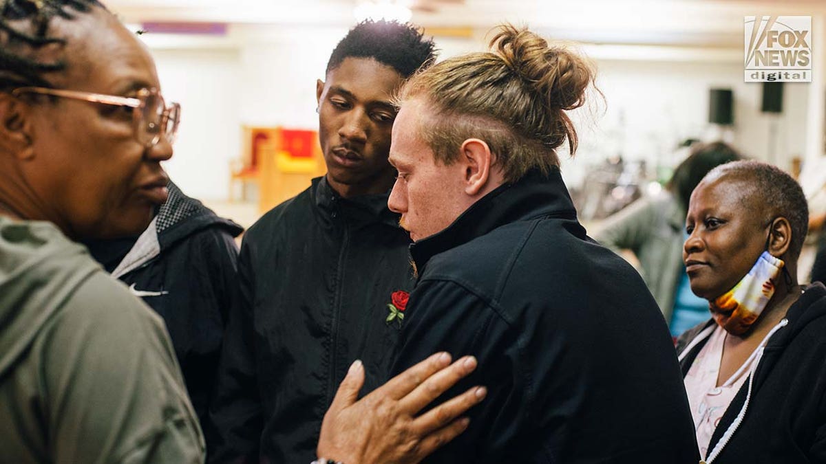 Friends, family, and church members mourn the loss of Zindell Brown at a church in Scranton, South Carolina.