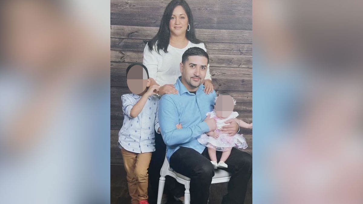 Aaron Orozco poses for a family with his wife and children