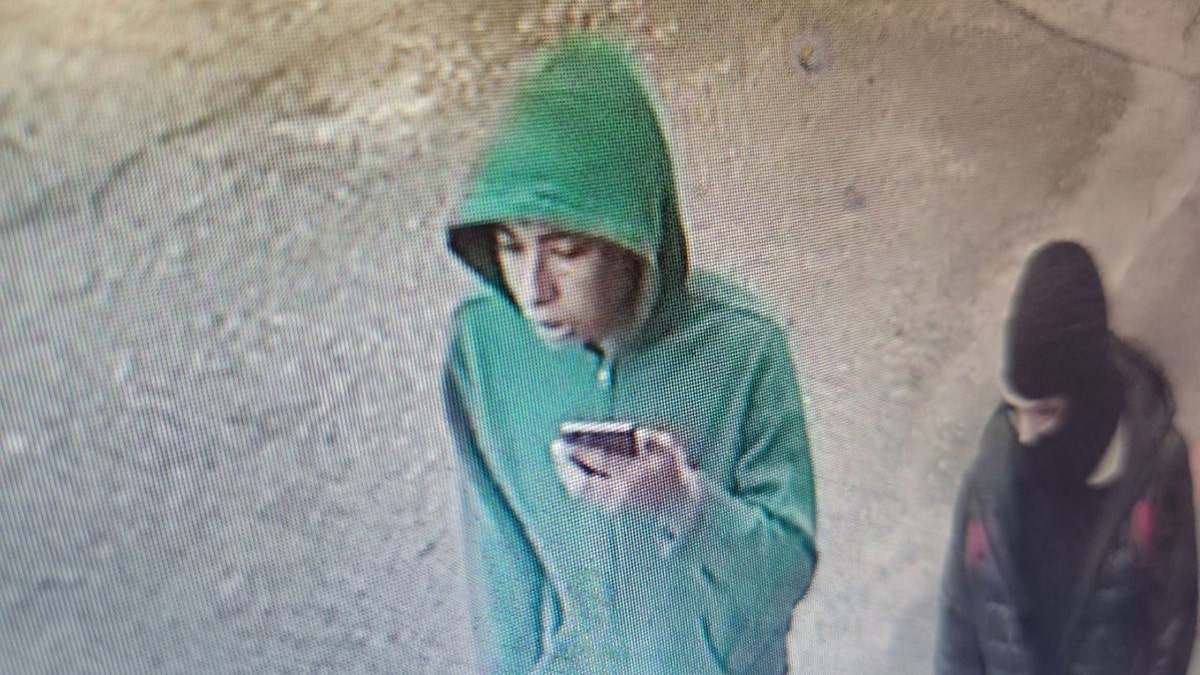 suspect in green hoodie