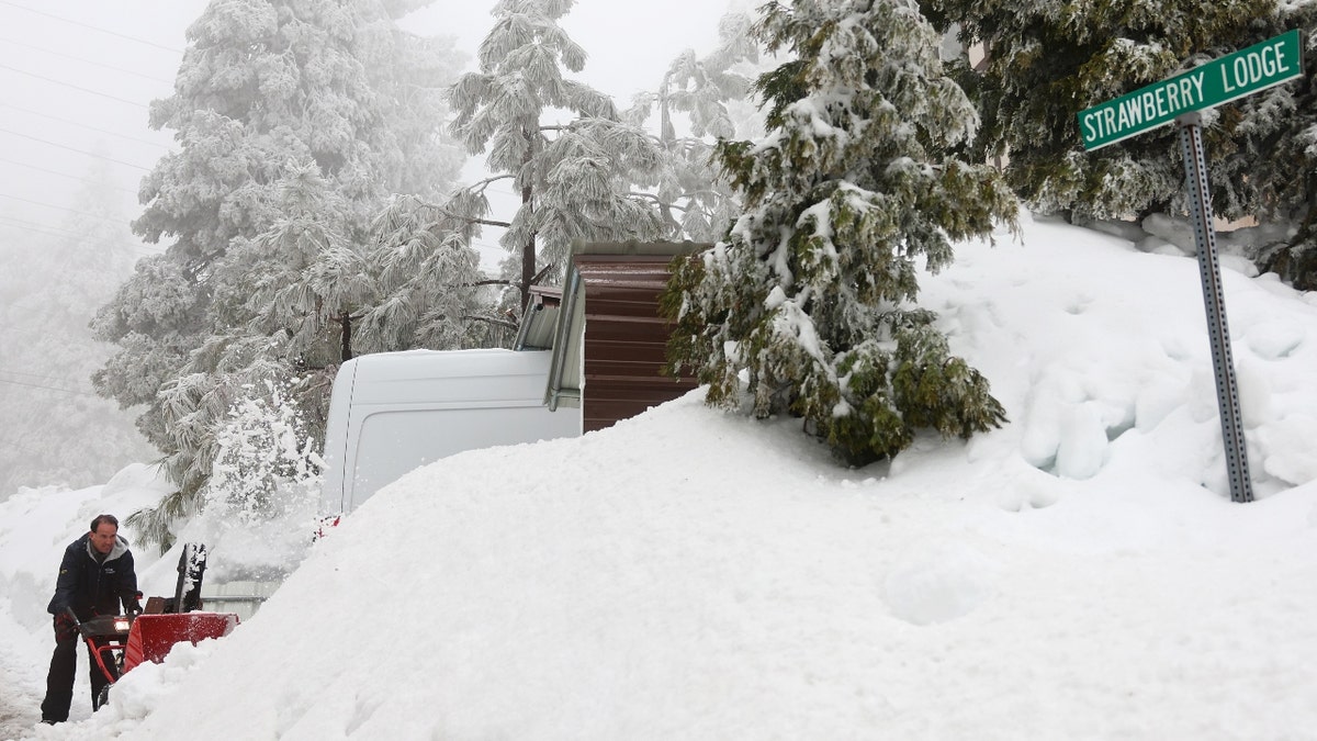 A man clears a driveway in southern California