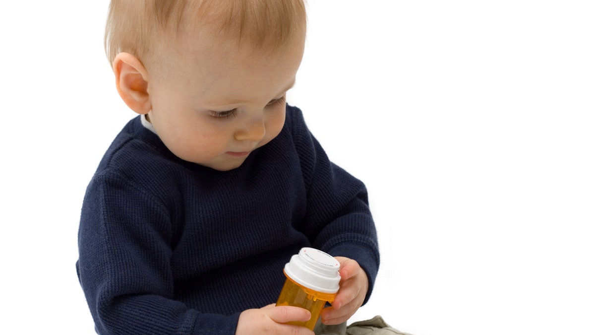 Baby with prescription bottle
