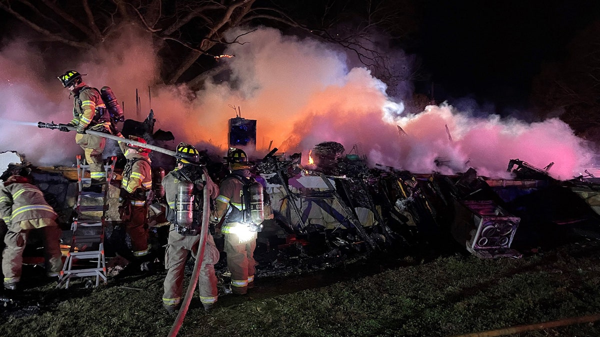 firefighters extinguishing fire