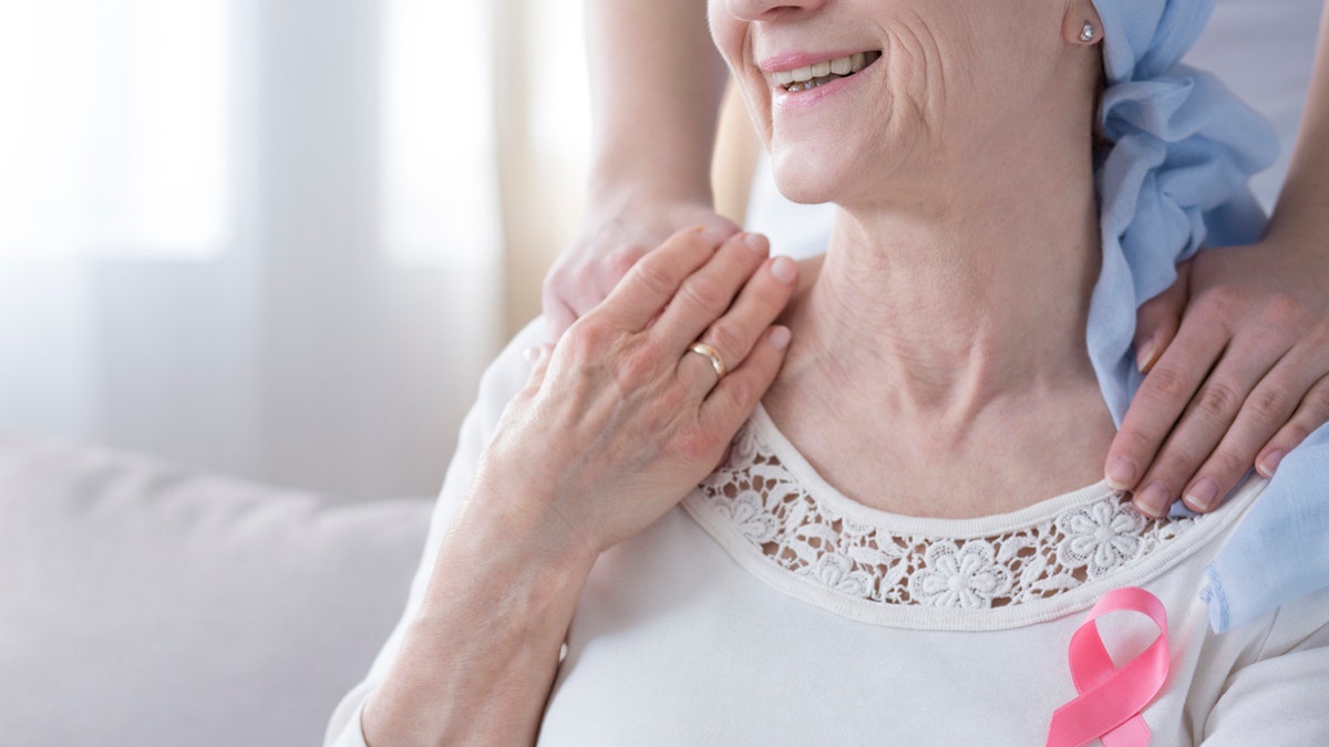 Woman with pink Breast Cancer ribbon