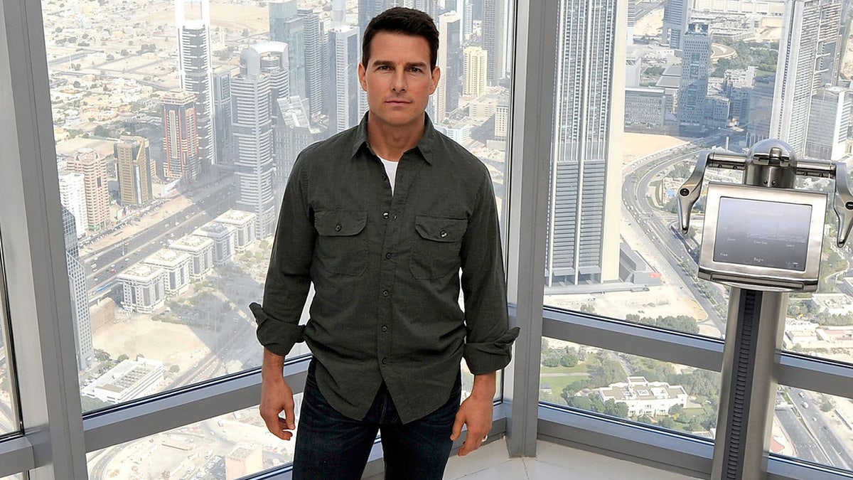 Tom Cruise standing inside the Burj Khalifa at a press conference for Mission Impossible