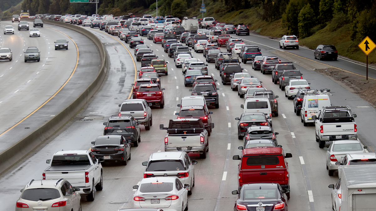 cars in bumper to bumper traffic on California freeway