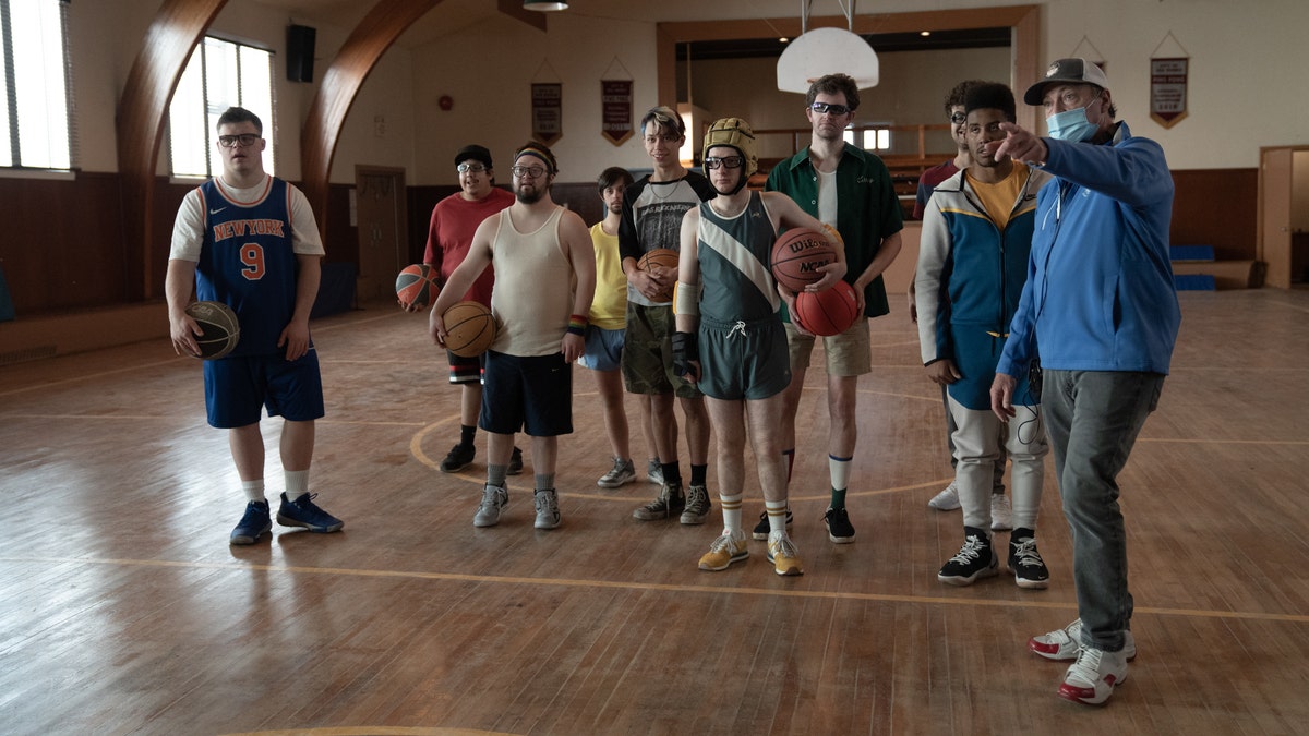 friends players standing on basketball court