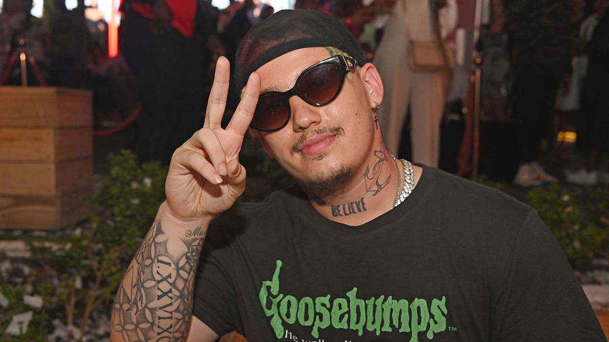 Rapper Costa Titch makes a peace sign