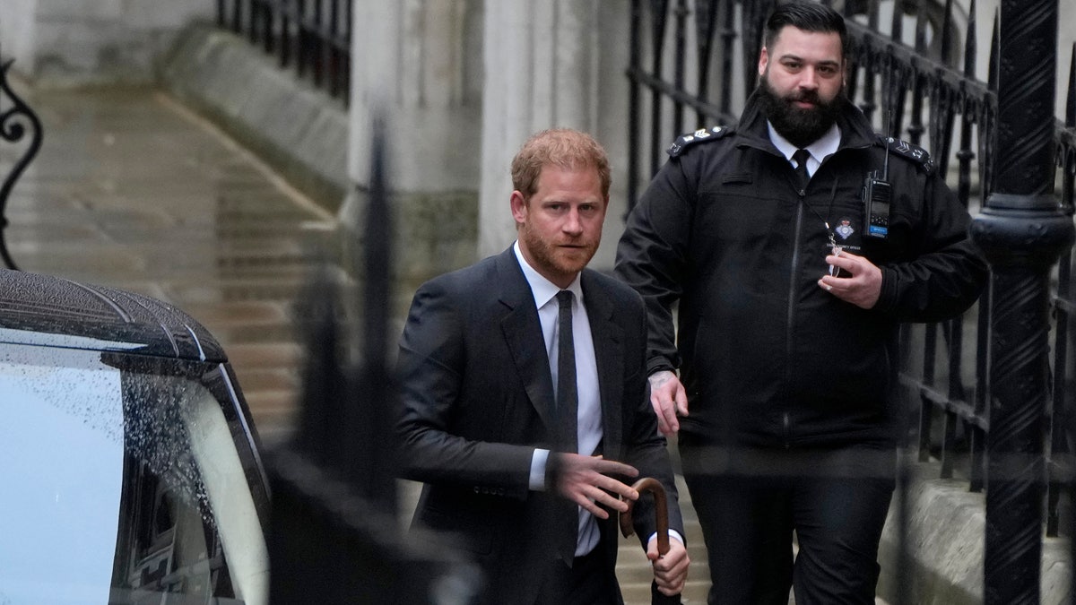 Prince Harry arrives for his second day at court.