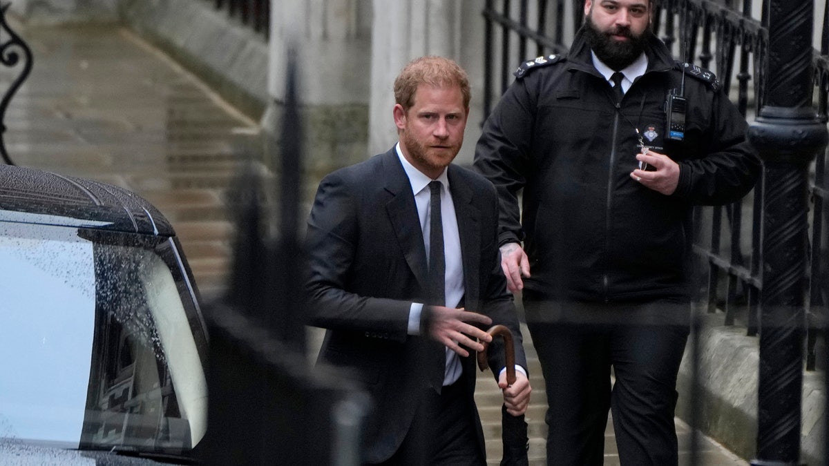 Prince Harry arrives for his second day at court.