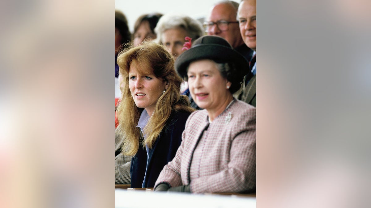 Sarah Ferguson watching a horse race next to her mother-in-law Queen Elizabeth II