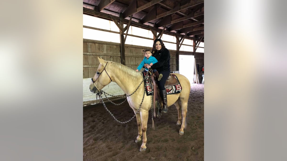 Dannie and daughter on horseback