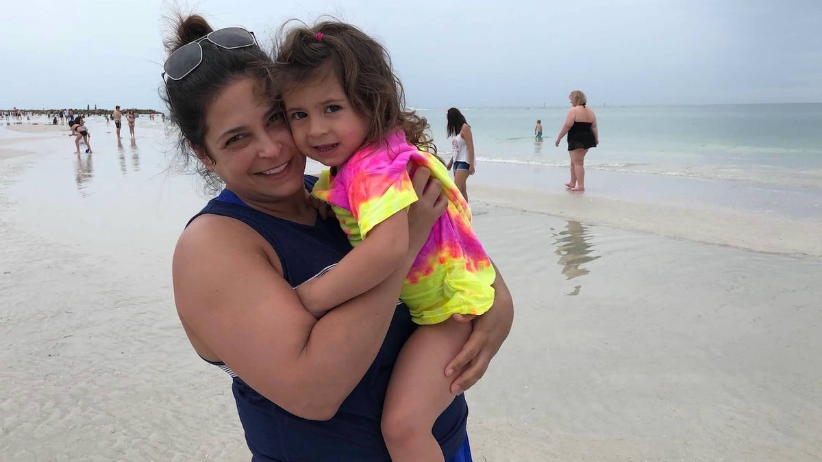 Dannie and her daughter on the beach