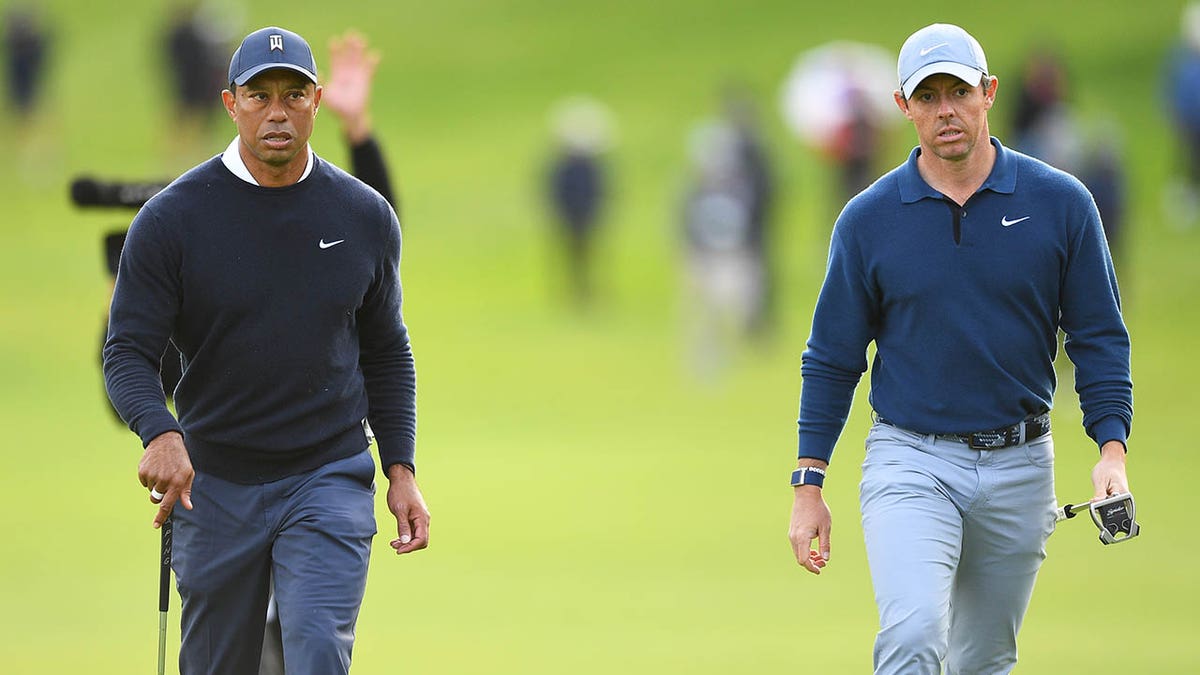 Tiger and Rory walking