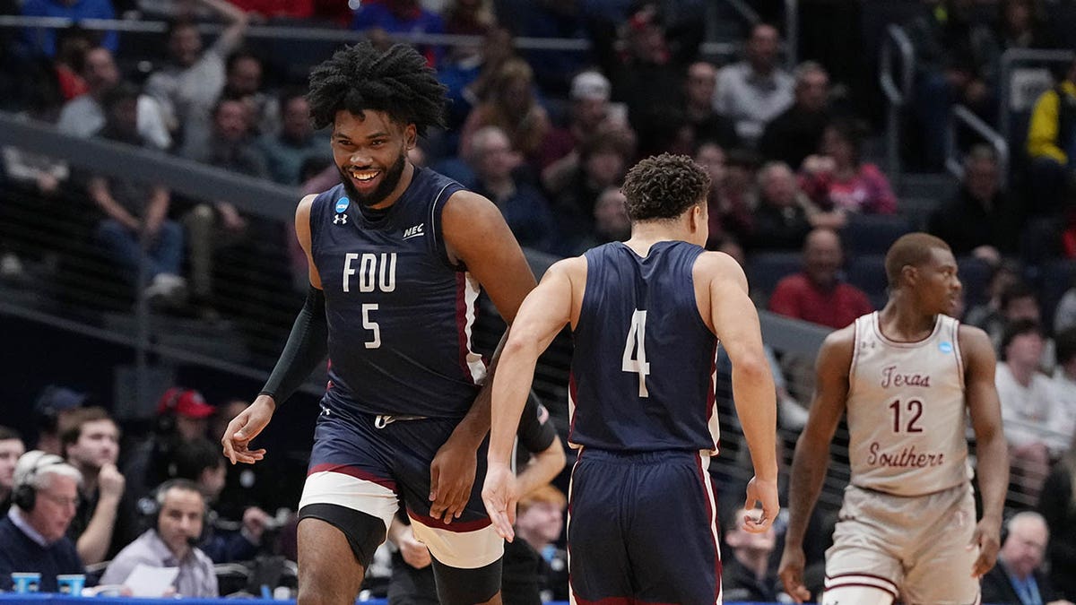 Ansley Almonor, #5 of the Fairleigh Dickinson Knights, celebrates after his made basket with Grant Singleton #4 against the Texas Southern Tigers during the second half in the First Four game of the NCAA Men's Basketball Tournament at University of Dayton Arena on March 15, 2023, in Dayton, Ohio.