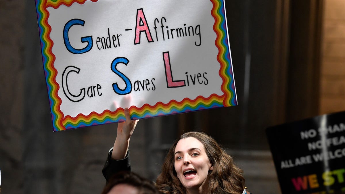 A protester shows her opposition to Kentucky Senate bill SB150, known as the Transgender Health Bill outside the Senate chamber at the Kentucky State Capitol in Frankfort, Ky., Wednesday, March 29, 2023.