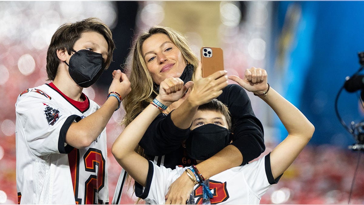 Gisele Bundchen with son Ben and stepson Jack at the Super Bowl