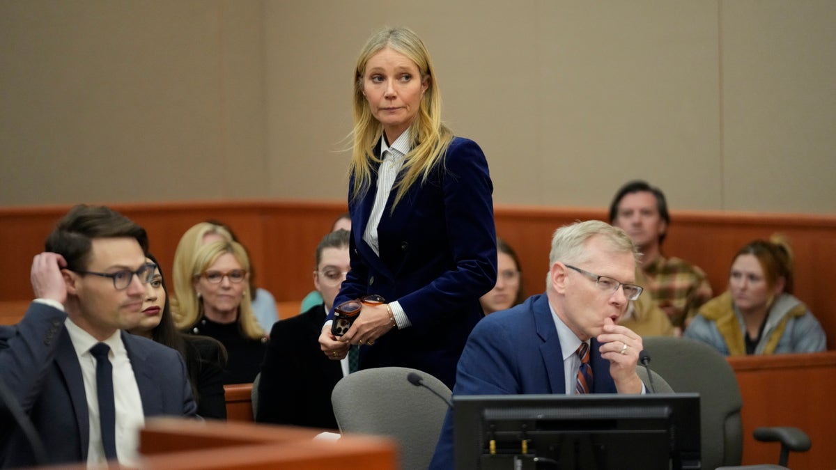 Gwyneth Paltrow wears blue velour jacket with slacks in court