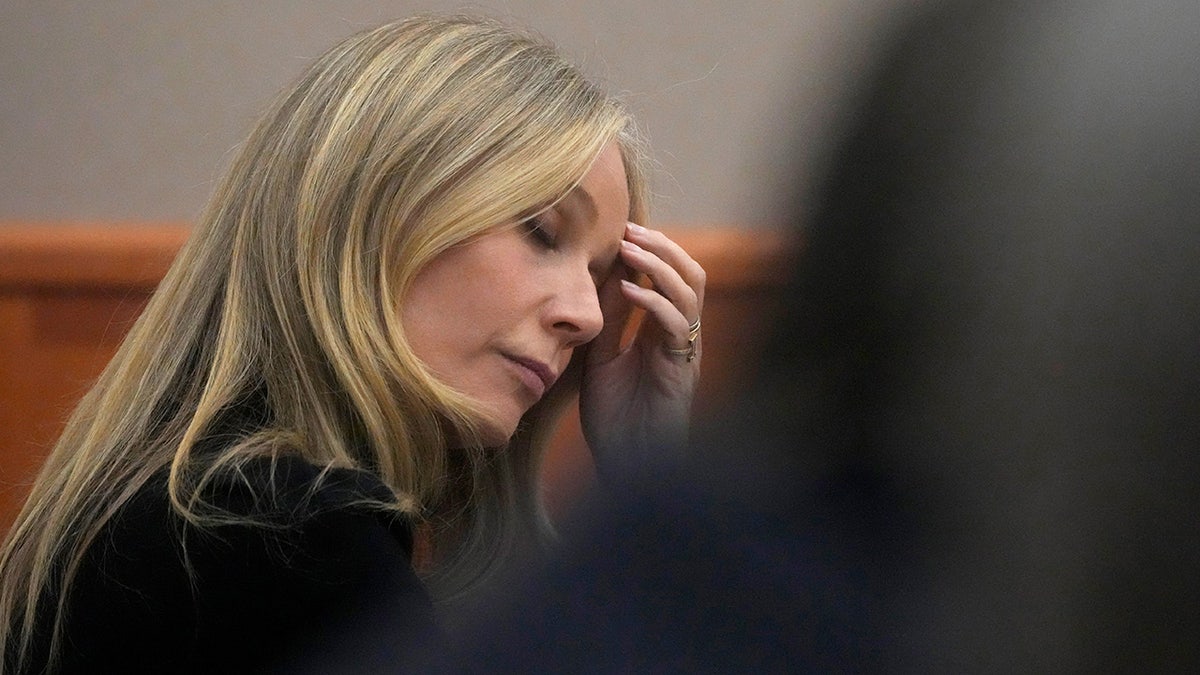 Gwyneth Paltrow rests her head in her hands while listening to testimony in ski crash case