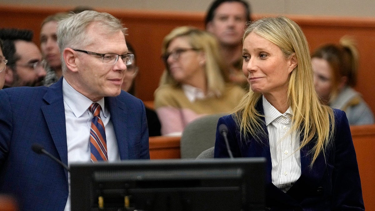 Gwyneth Paltrow smiles at her legal counsel after hearing verdict in ski crash trial