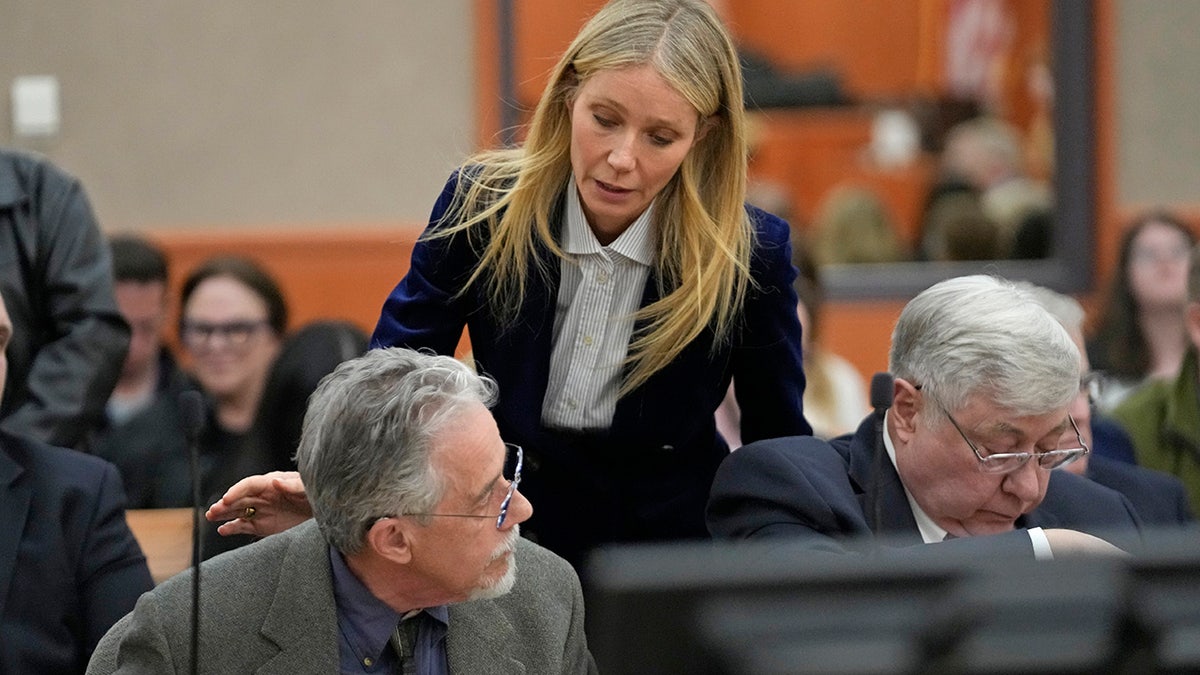 Gwyneth Paltrow touches Terry Sanderson's back after verdict is read in court
