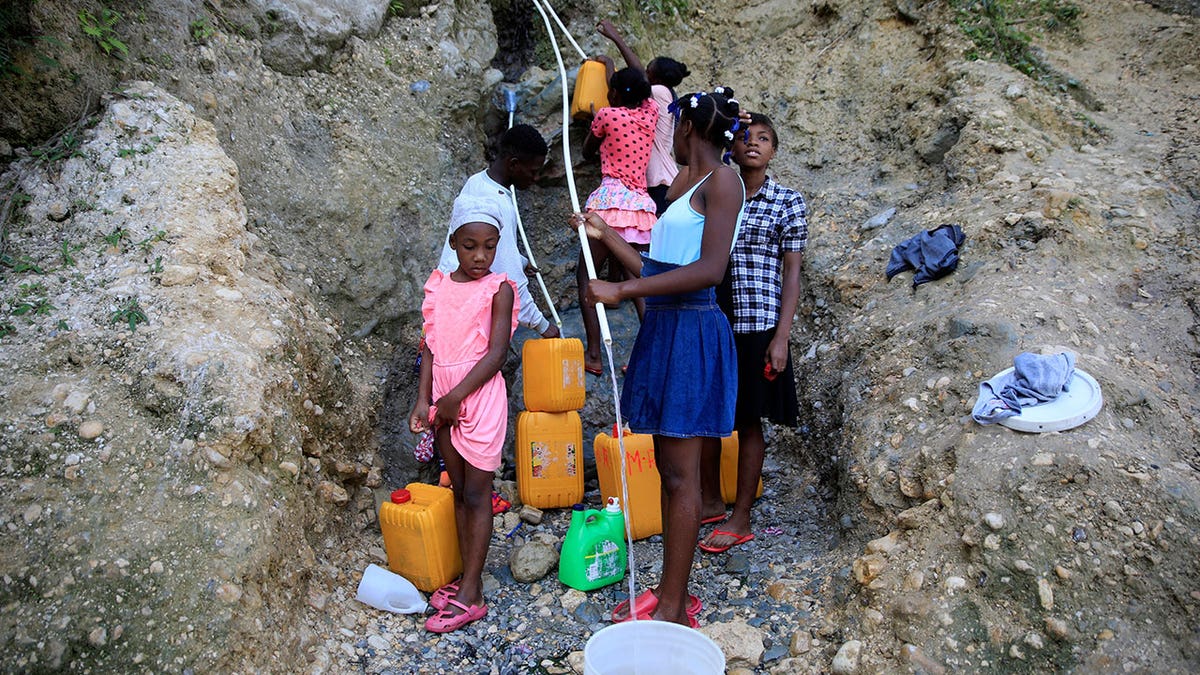 People getting water in Haiti 