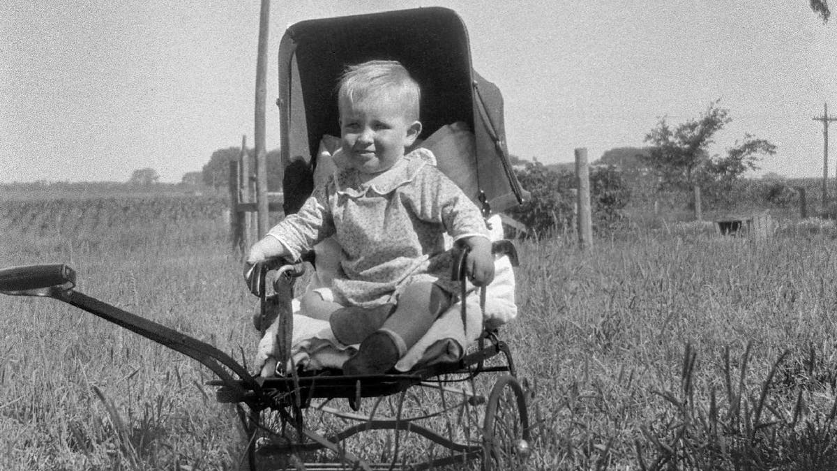 Baby boy from 1920s in carriage