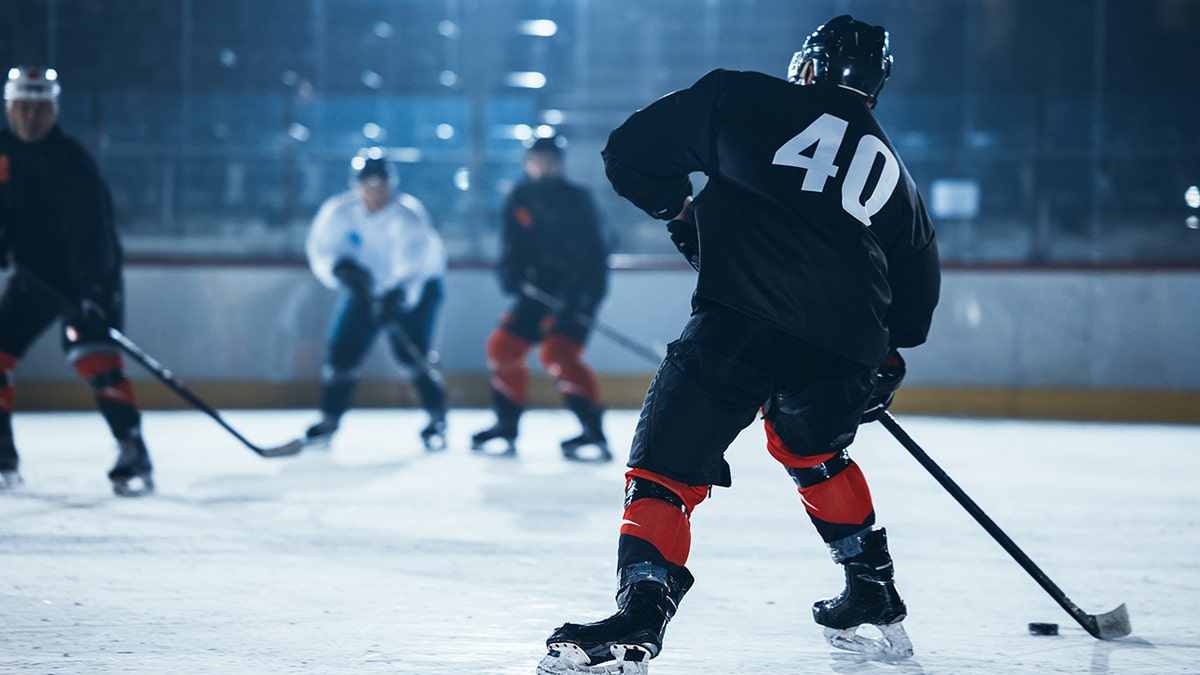 hockey player going down the ice