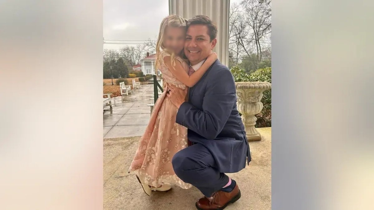 Missing Nathan Miller poses with his daughter
