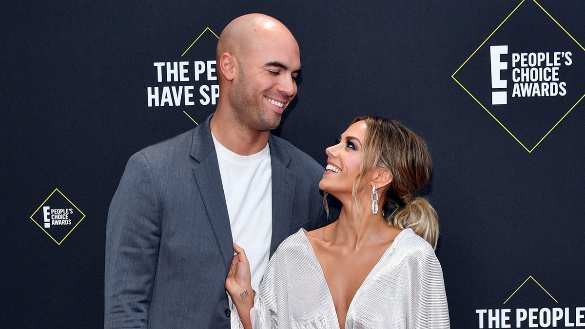 Jana Kramer smiling with Mike Caussin