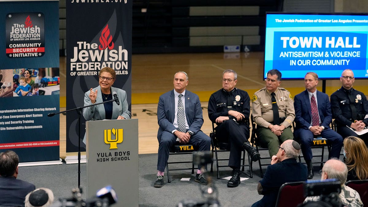 Los Angeles Mayor Karen Bass, at podium, addresses antisemitic violence on Feb. 20, 2023, at an event following recent shootings targeting Jewish community members.