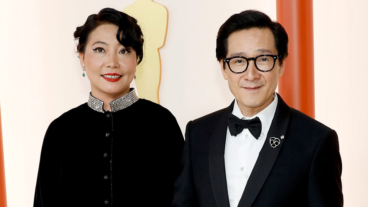 Ke Huy Quan walks Oscars red carpet with wife Echo.