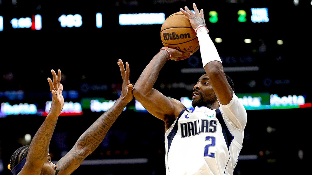 Kyrie shoots the ball during a game