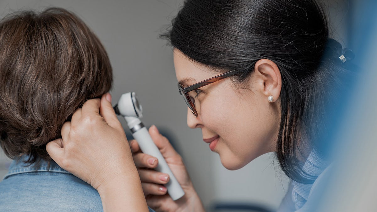 boy getting ear checked