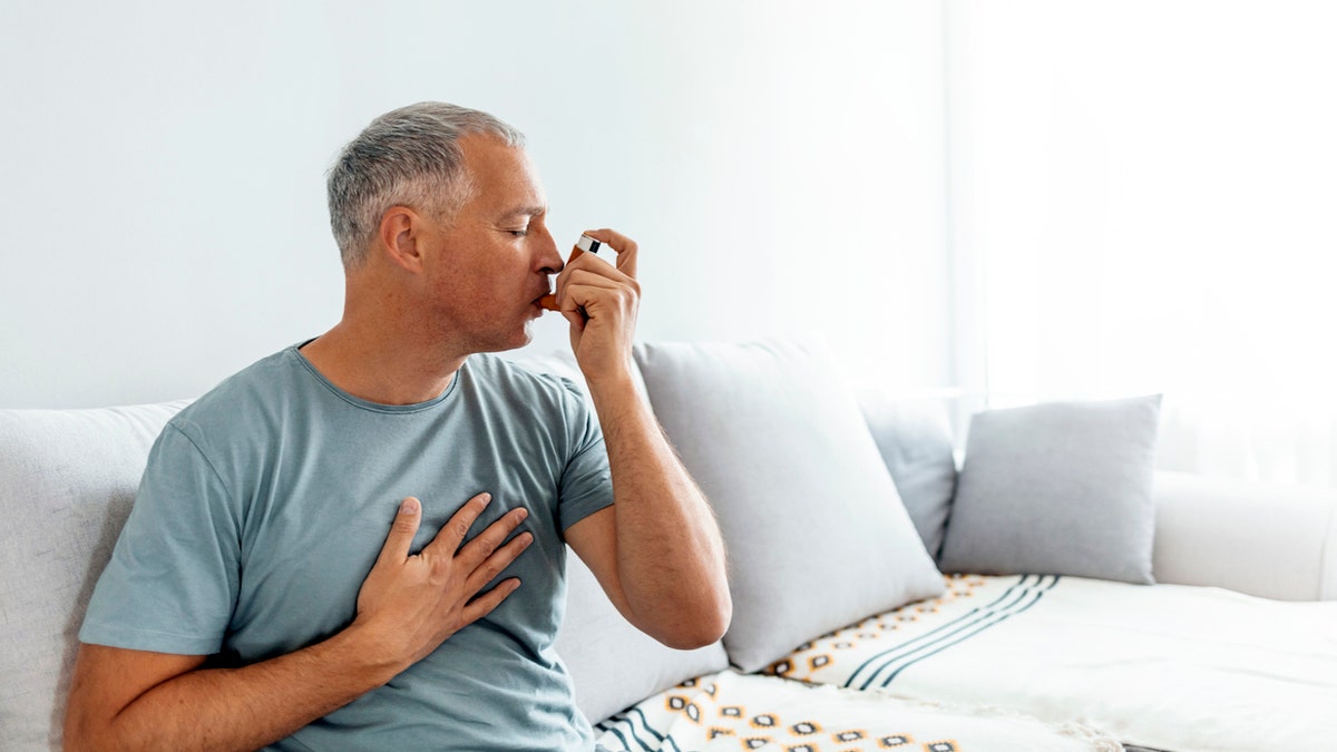 Man utilizing inhaler