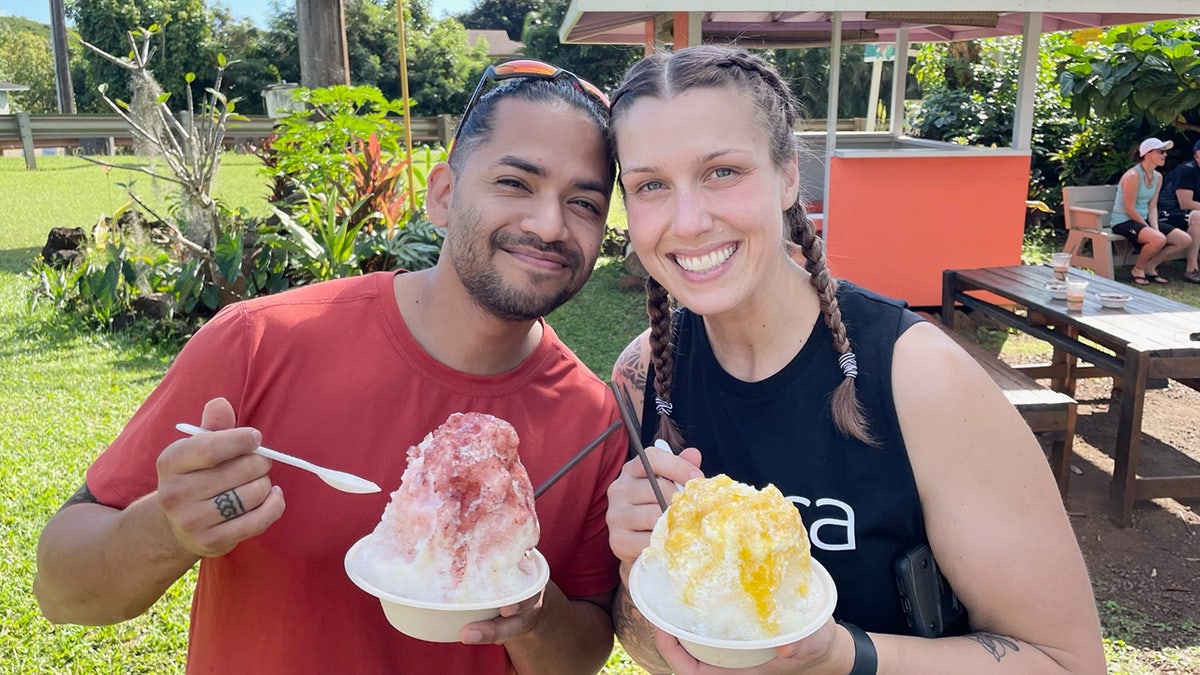 Mario Fernandez and Shanna Gardner Fernandez eat snow cones in Hawaii.