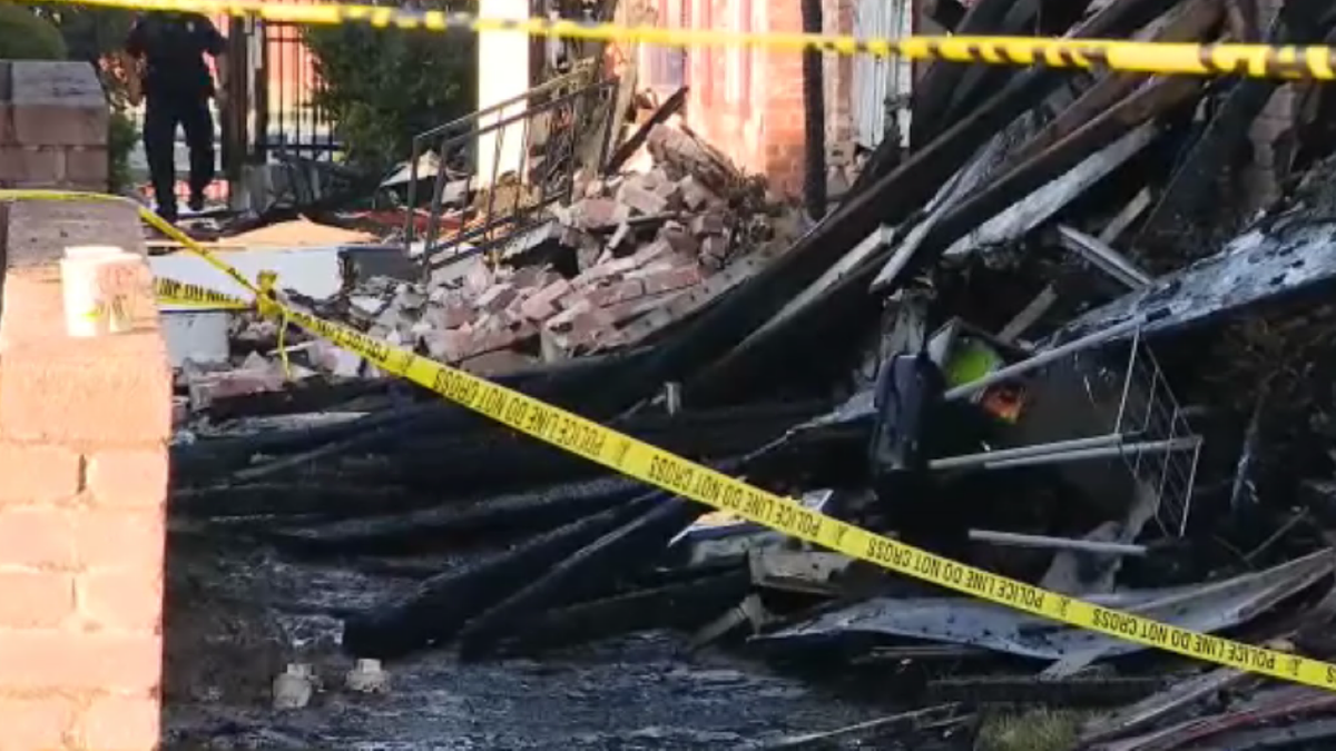 Debris and yellow tape after arson