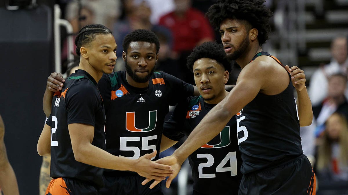 Miami Hurricanes huddle