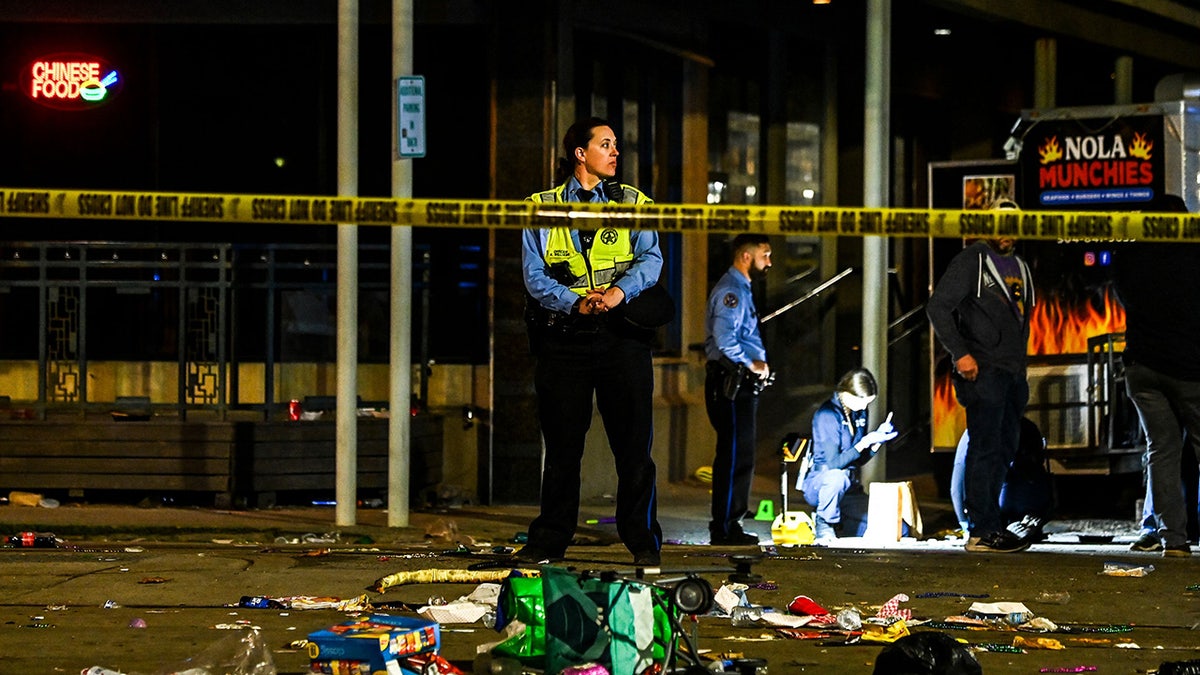 Police collect evidence at New Orleans parade shooting scene