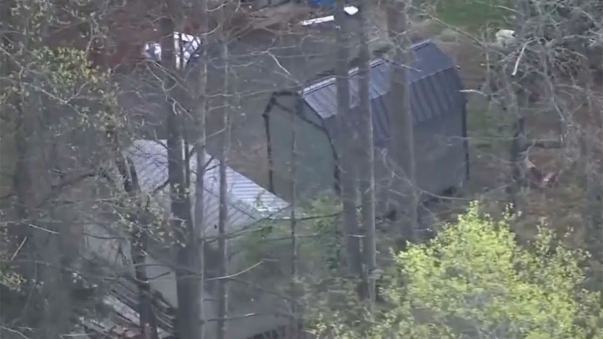 Aerial shot of North Carolina house with red roof and shed