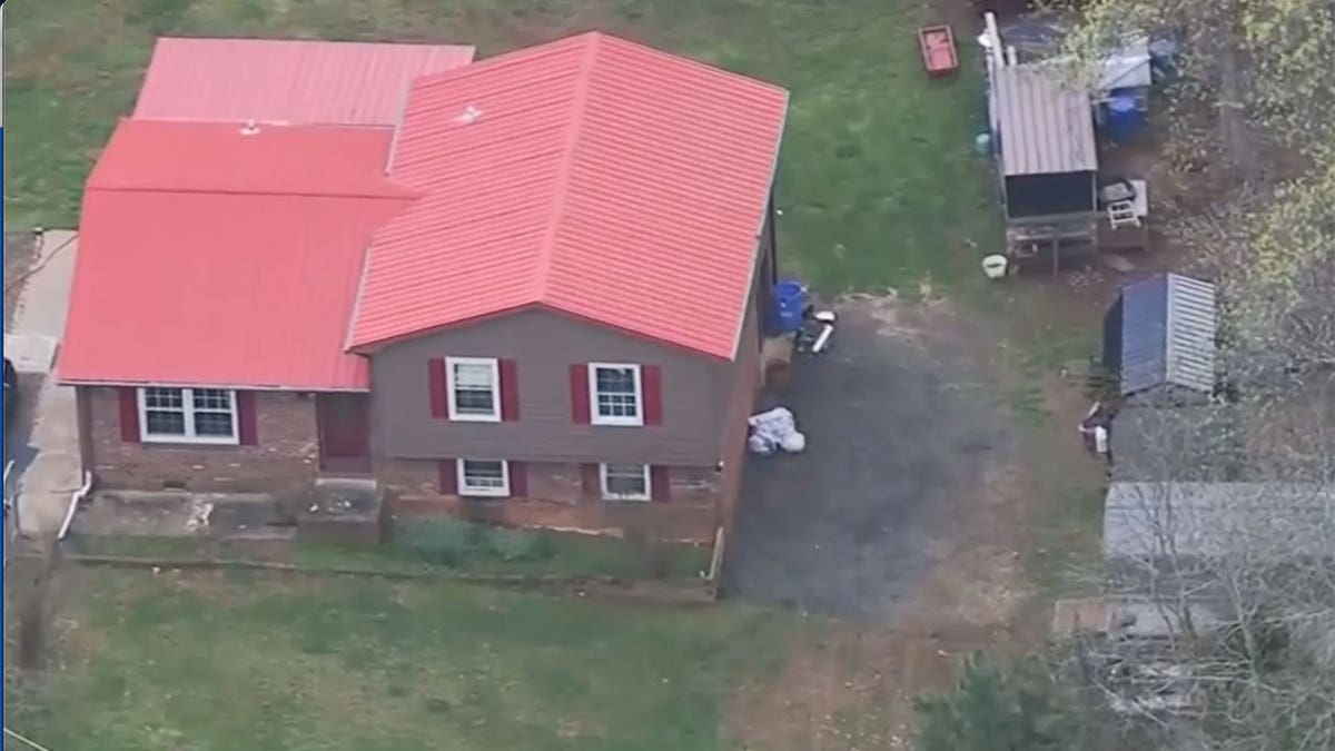 Aerial shot of North Carolina house with red roof and shed