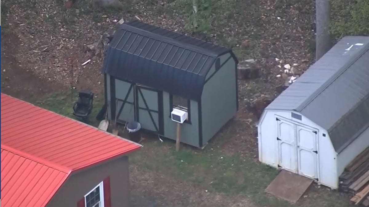 Aerial shot of North Carolina house with red roof and shed