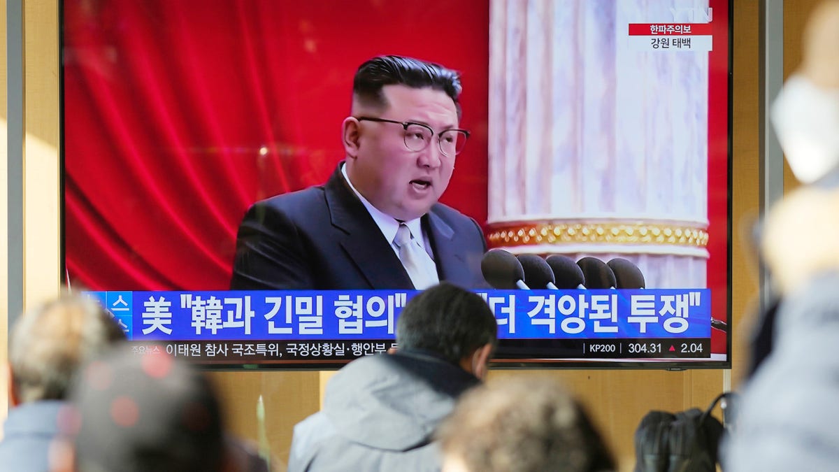 A TV screen shows a news program reporting with footage of North Korean leader Kim Jong Un in Pyongyang, at the Seoul Railway Station in Seoul, South Korea, on Dec. 27, 2022