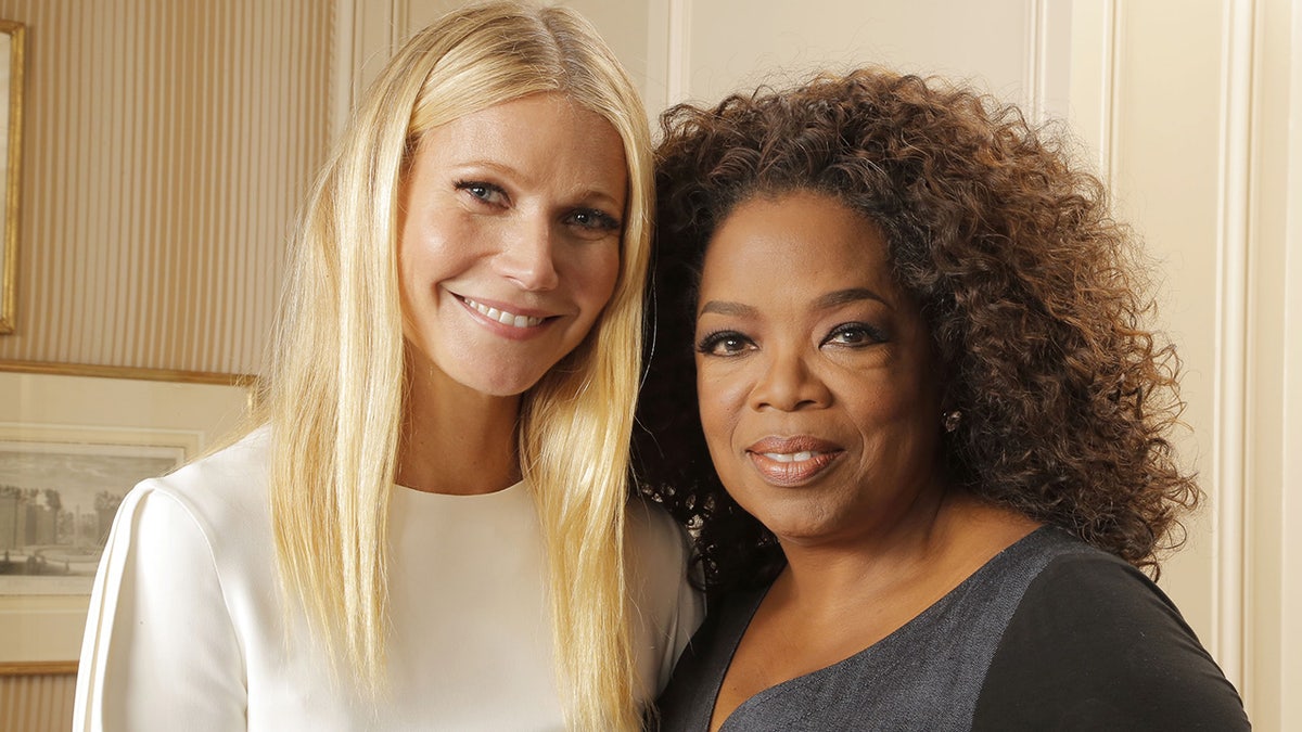 Gwyneth Paltrow and Oprah Winfrey smile in portrait photos
