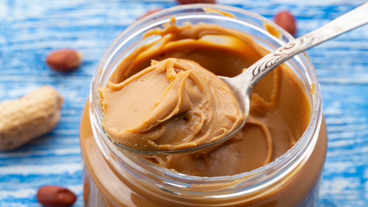peanut butter from a jar with a spoon