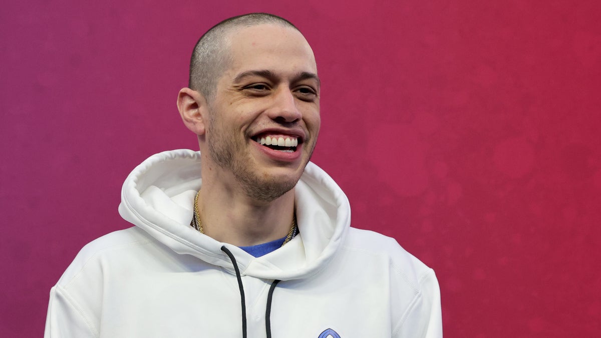 Pete Davidson gives a big smile for a photo.