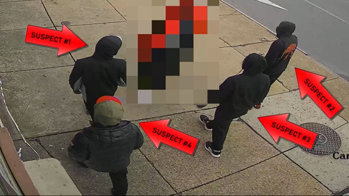 four suspects walking along sidewalk