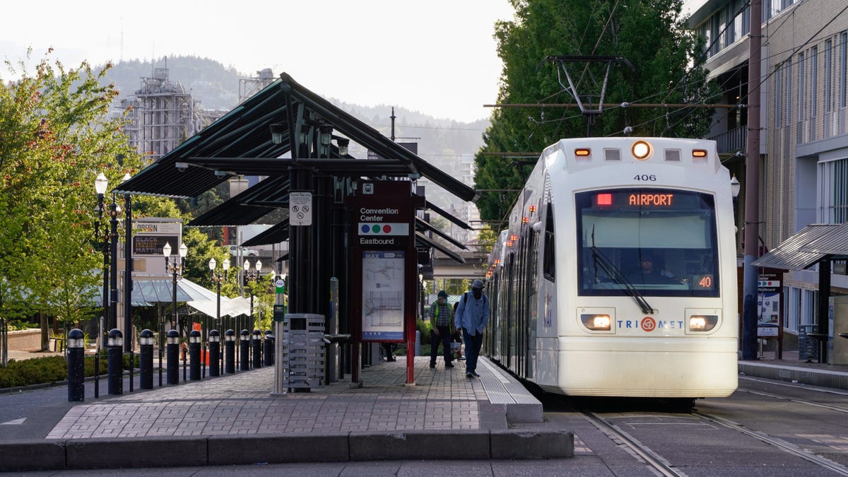 Commuters board a TriMet Metropolitan Area Express (MAX) Light Rail at a stop in Portland, Oregon, U.S., on Wednesday, June 17, 2020.
