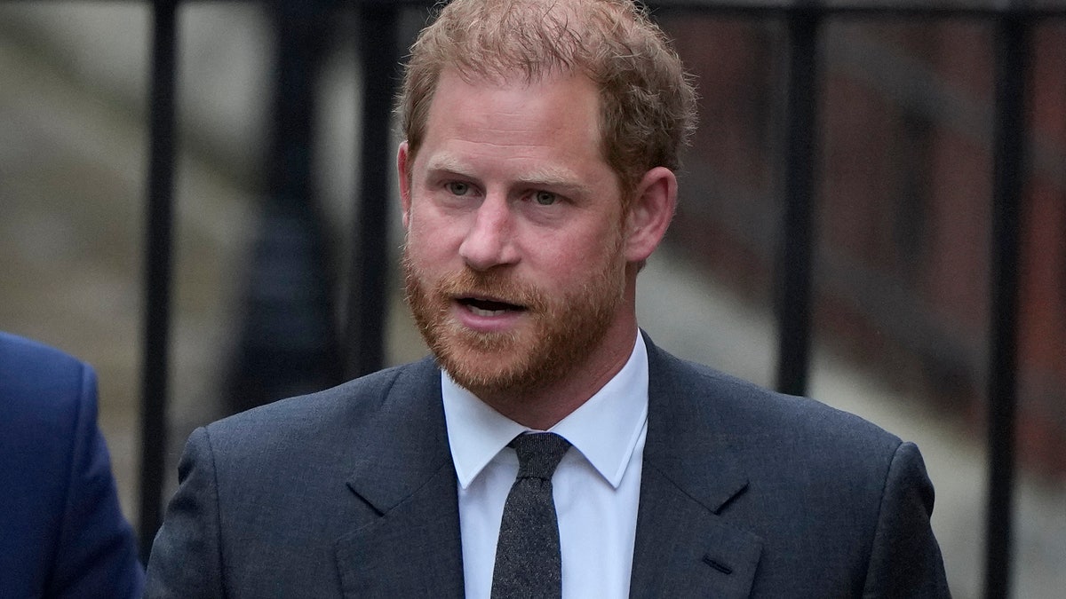 Prince Harry wears a blue suit as he shows up to court.